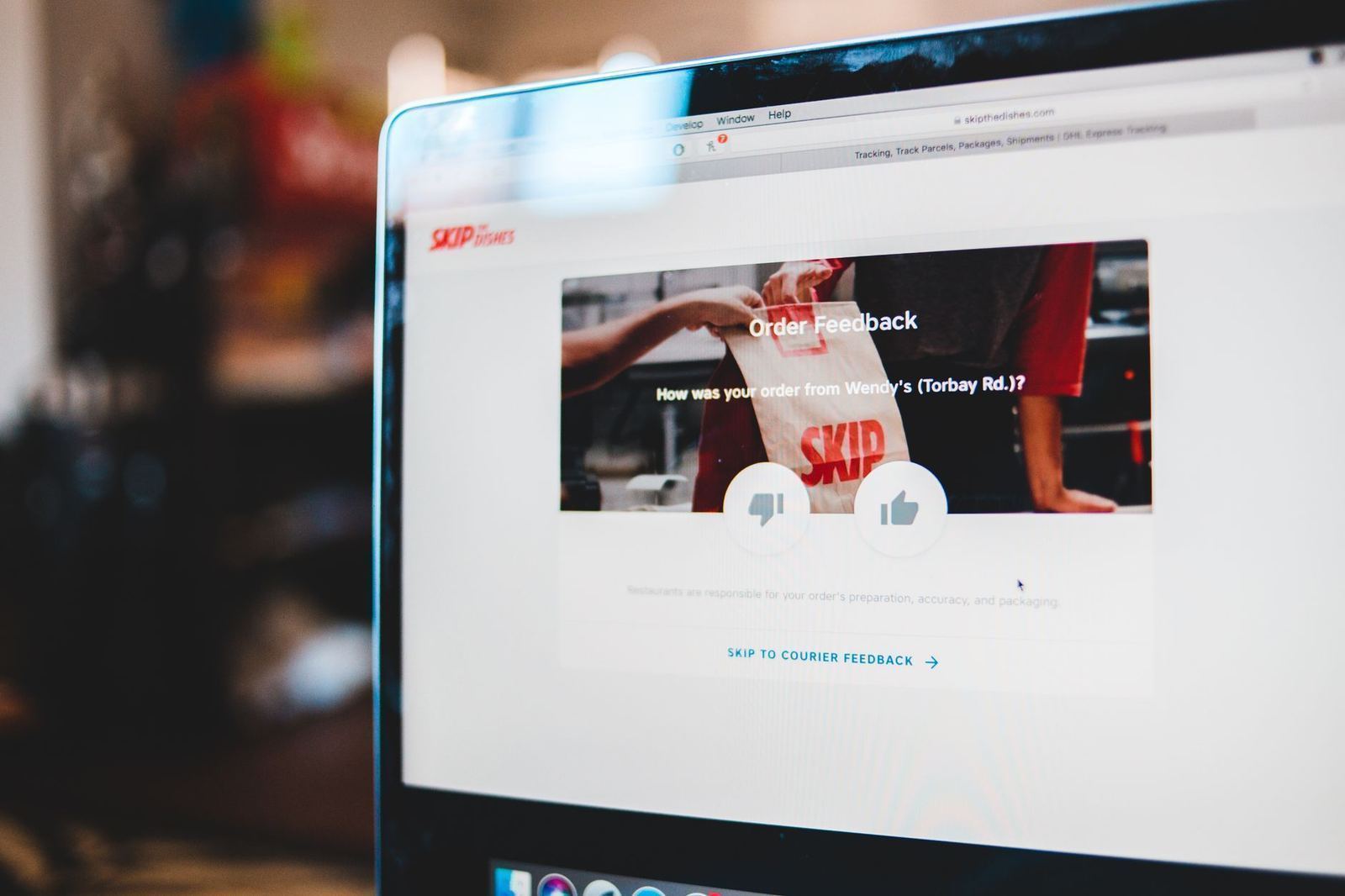 A person reviewing feedback and comments on a laptop screen