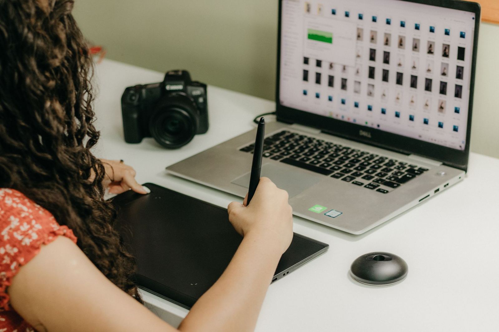 A designer reviewing creative work on a laptop screen
