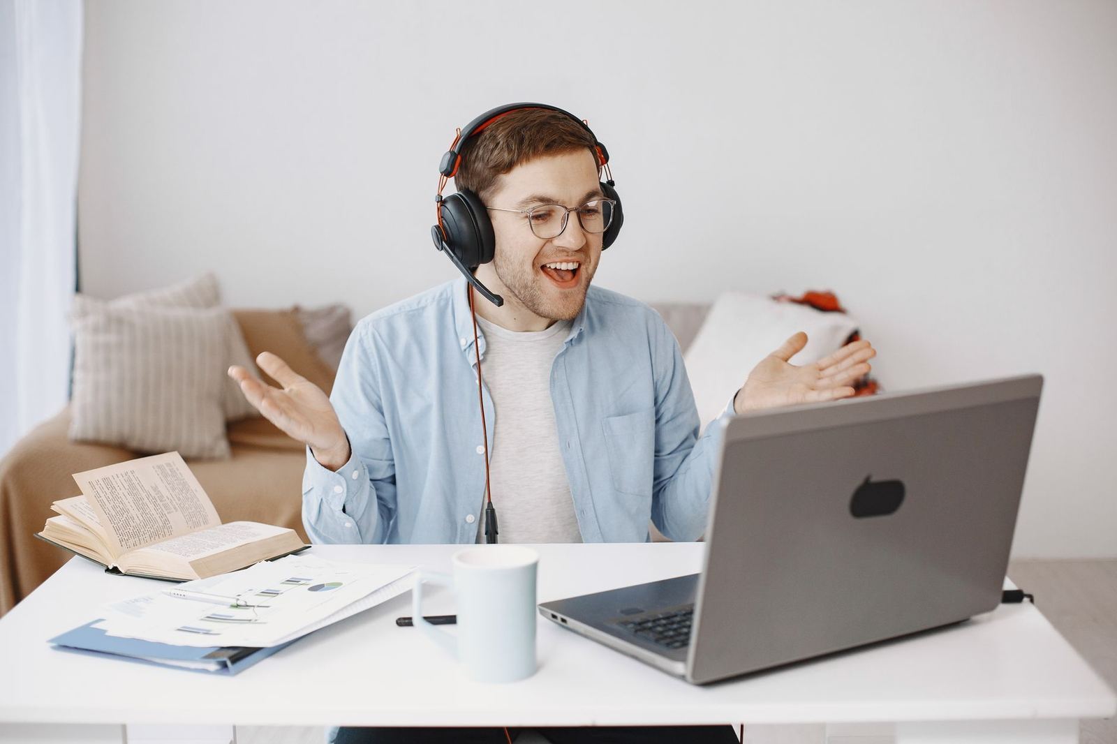 A freelance video editor on a laptop during a client call