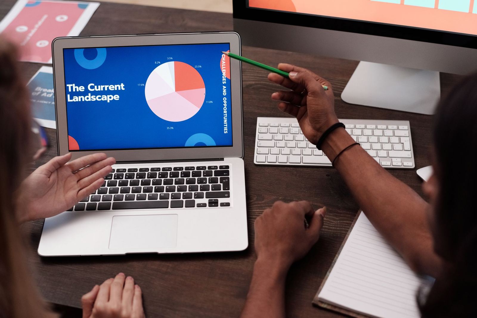 A designer annotating feedback on a screen