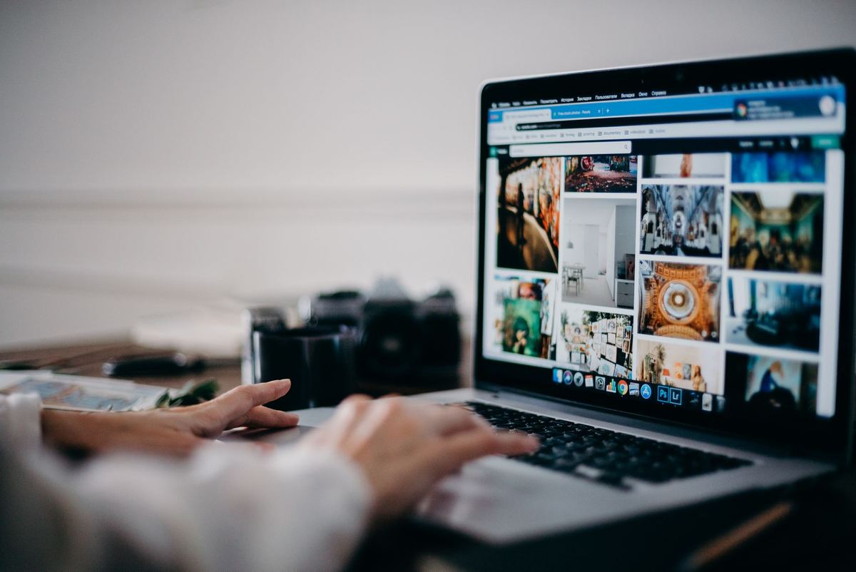 A person uploading a file from a laptop