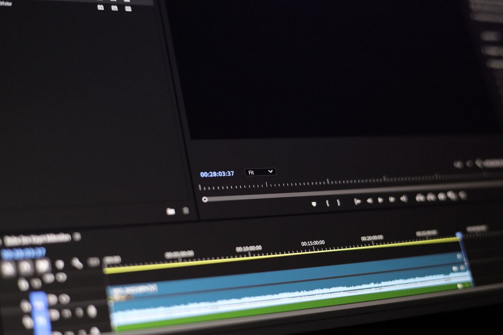 Close-up of a video editing timeline with timecodes and waveform