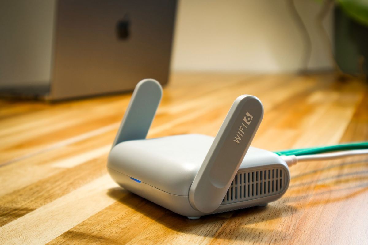 A person checking a wifi router