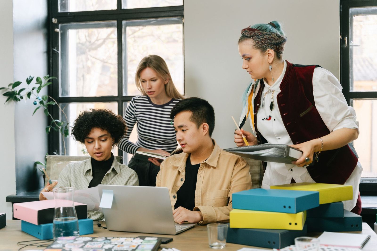 A creative team reviewing project files together